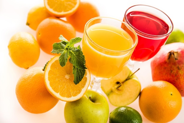 Glasses of juice and healthy fruits