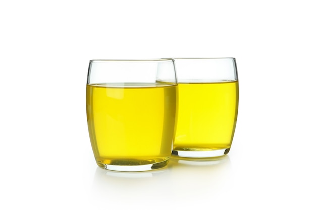 Glasses of lemon jelly isolated on white wall