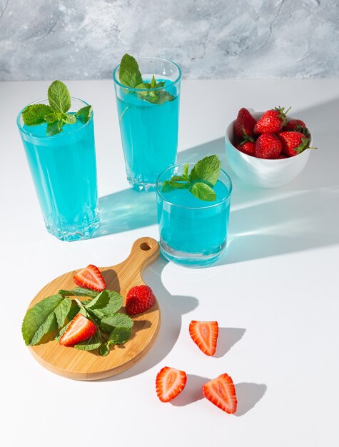 glasses of mojito with mint and strawberries