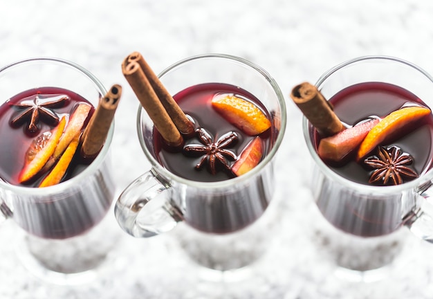 Glasses of mulled wine in snow