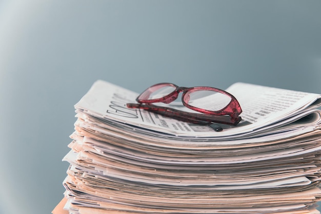 Photo glasses on newspapers