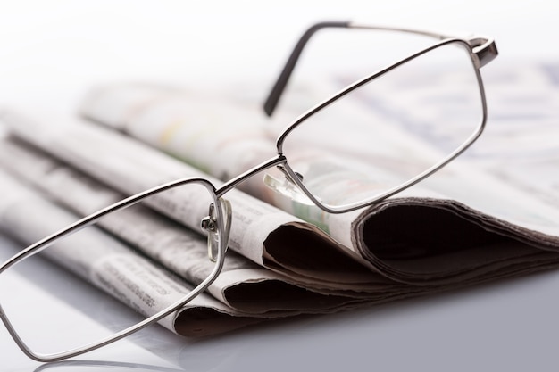 Glasses on the newspapers