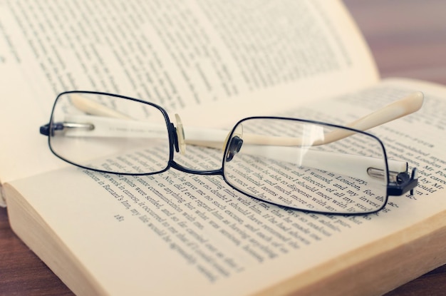 Glasses on an old book