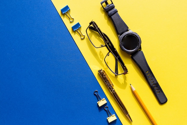 Glasses, smart watch and office supplies