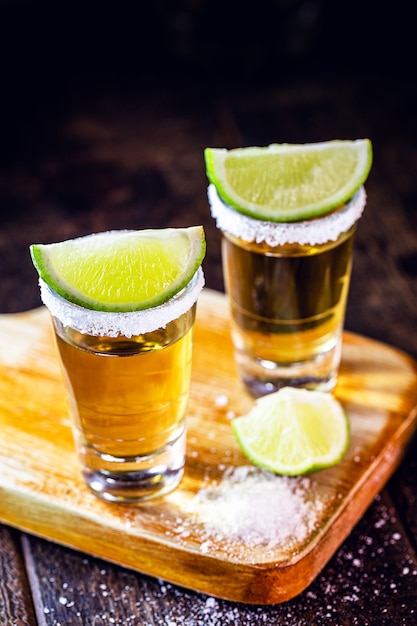 Glasses of tequila with lemon and salt drink originating in mexico