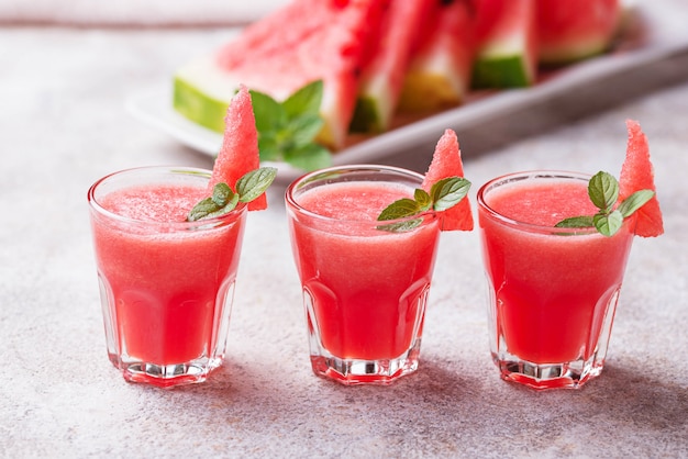 Glasses of watermelon smoothie with mint