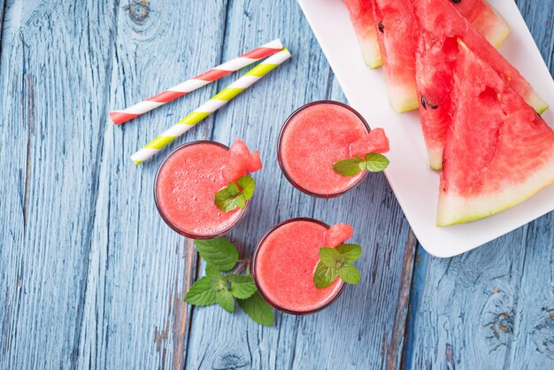 Glasses of watermelon smoothie with mint