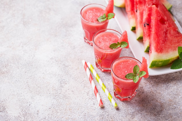 Glasses of watermelon smoothie with mint