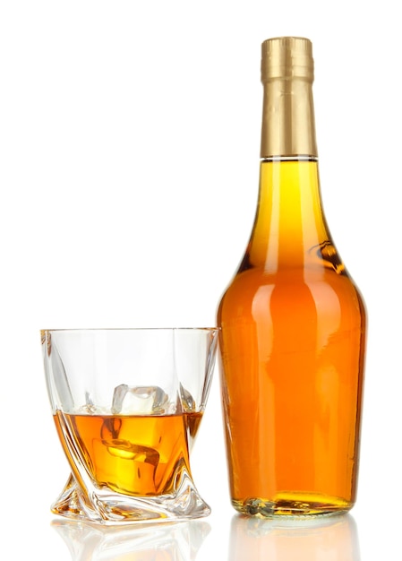 Glasses of whiskey with bottle isolated on white