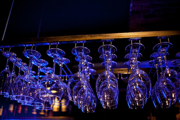 Glasses of wine Glasses hanging above the bar in the restaurant Empty glasses for wine