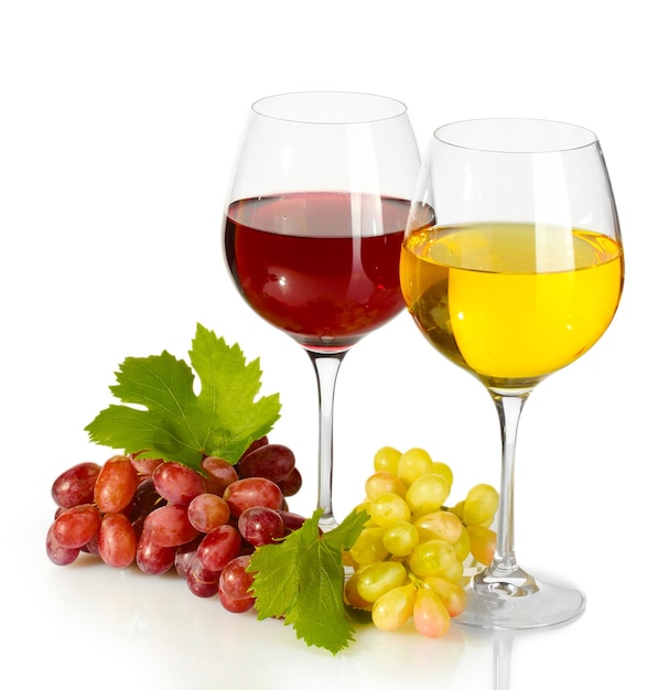 Glasses of wine and ripe grapes isolated on white