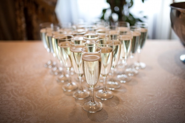 Glasses with champagne on the table