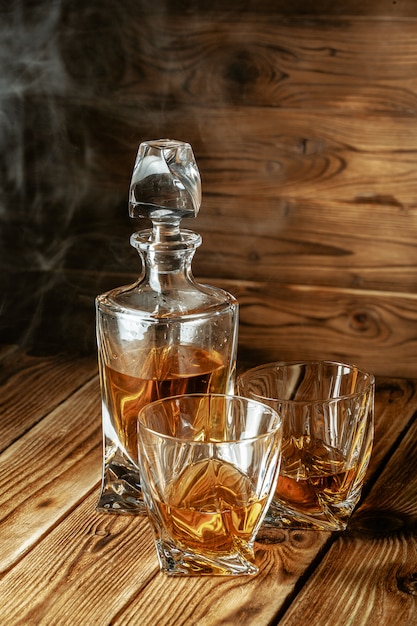 Glasses with cognac, whiskey stand on the bar