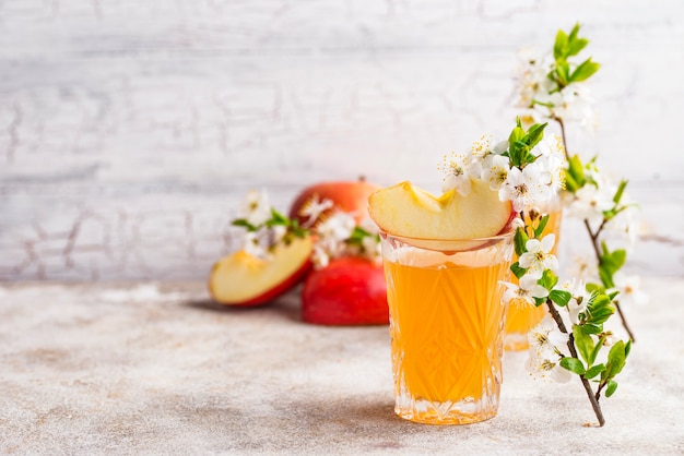 Glasses with fresh apple juice or cider 