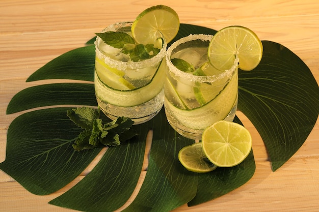 glasses with fresh cold lemonade with mint and lime