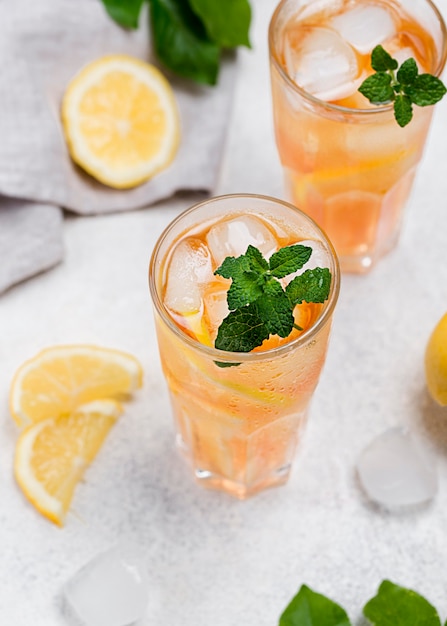 Photo glasses with fresh ice tea on desk