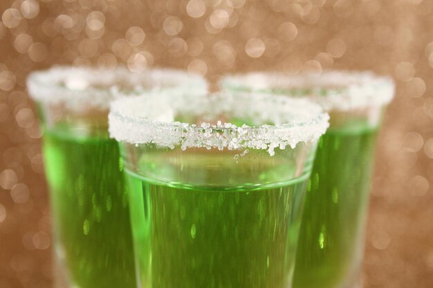 Glasses with a green cocktail