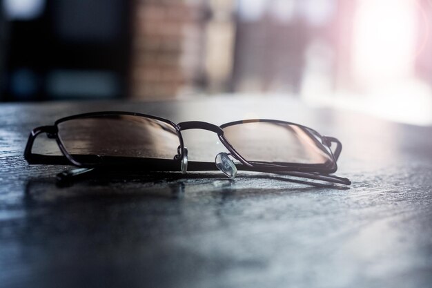 Glasses on a wooden table the sun's rays from the window