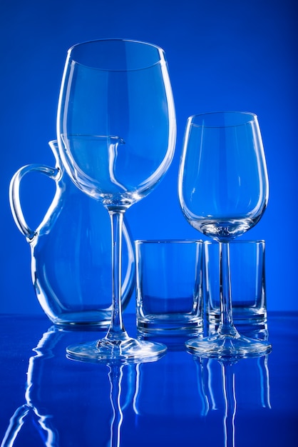 Glassware for drinks on a blue