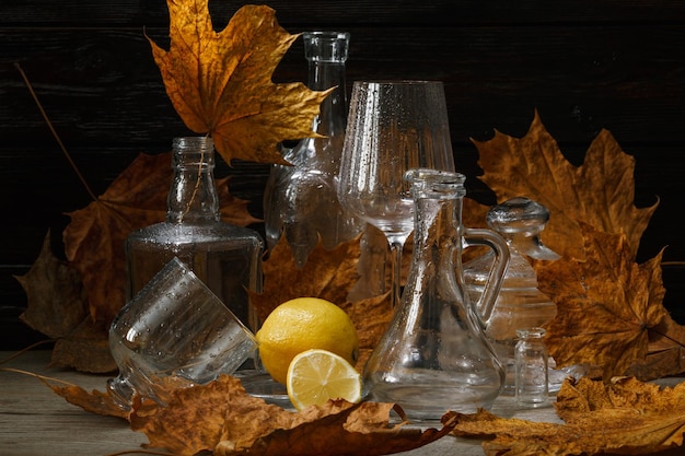 Glassware maple leaves closeup still life autumn