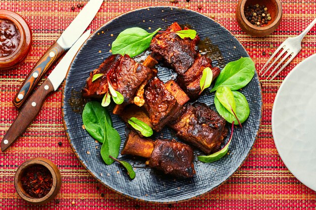 Glazed barbecue beef ribs with herb