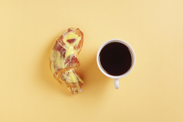 Glazed bun and coffee