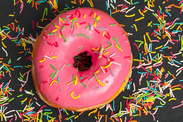 Glazed colored donut with sprinkles