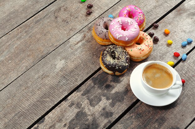 Glazed donuts on wooden table