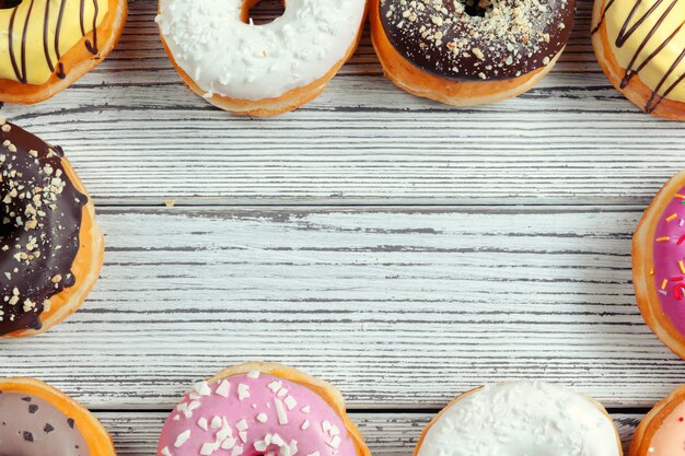 Glazed donuts on wooden 