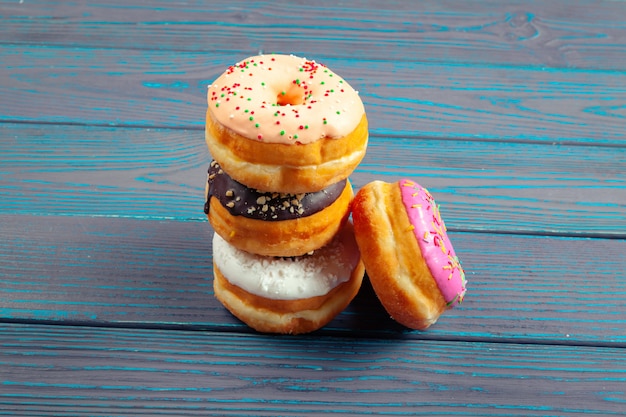 Glazed donuts on wooden 