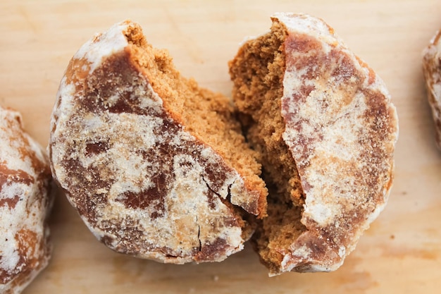 Glazed gingerbread, broken in half.