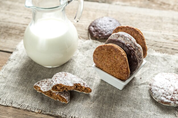 Glazed gingerbread cakes with pitcher of milk