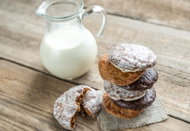 Glazed gingerbread cakes with pitcher of milk