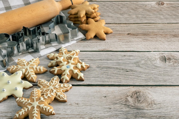 Glazed gingerbread cookies on a wooden background copy space