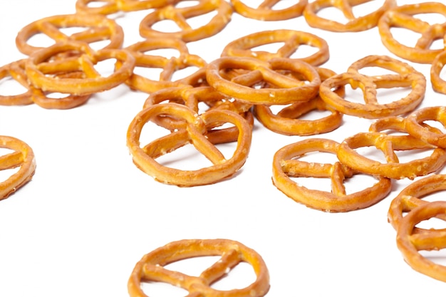 Glazed and salted pretzels isolated on white 