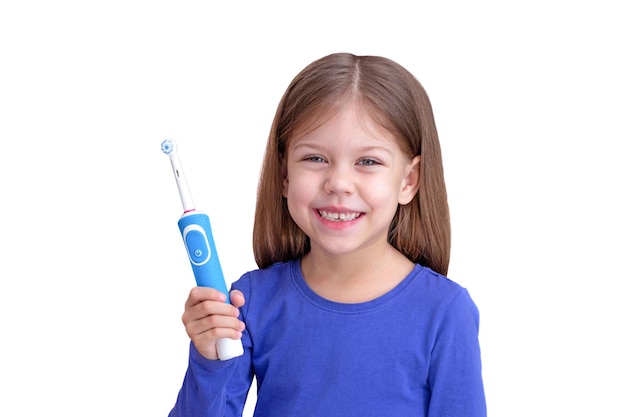 Glimlachend kind met elektrische tandenborstel