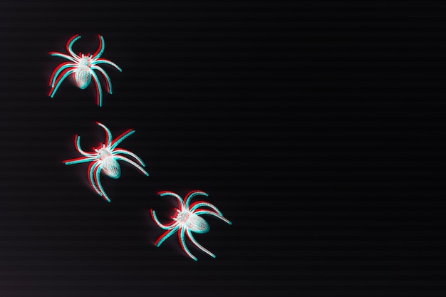 Photo glitch effect on white spiders and black background