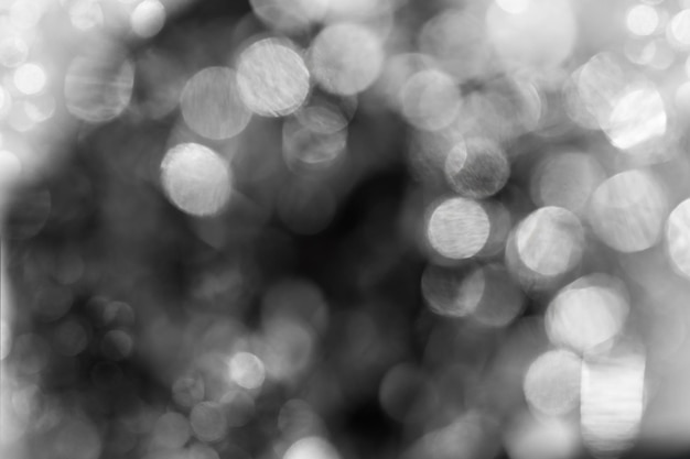 Glitter bokeh zwarte achtergrond voor gebruik als textuurlaag in uw project