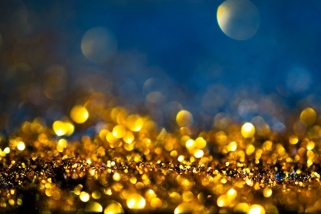 Glitter gold lights grunge background