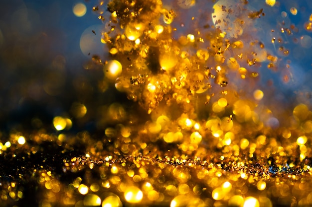 Glitter gold lights grunge background