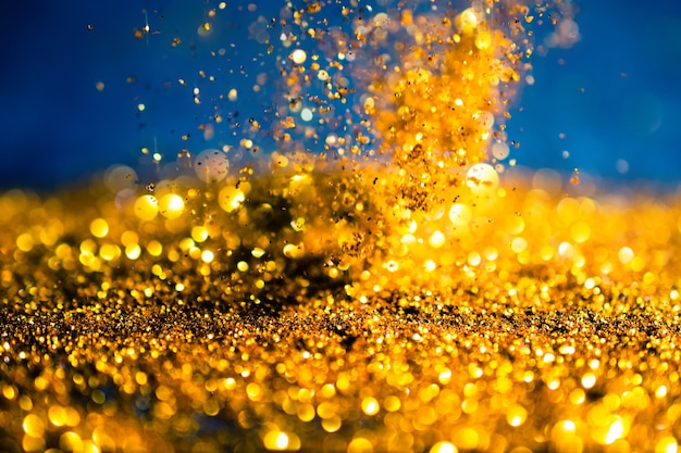 Glitter gold lights grunge background