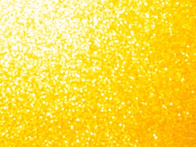 Foto glitter gouden achtergrond kerstmis gele kleur glansfolie confetti licht zilver glinsteren