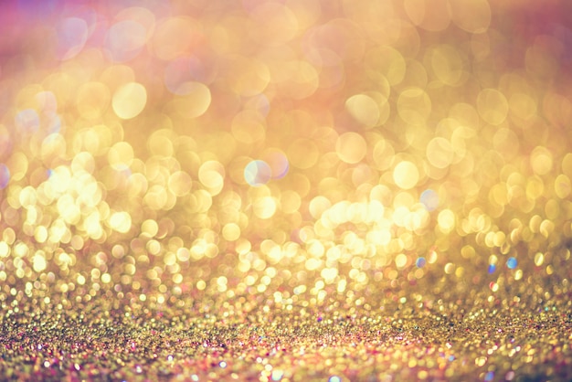 Glitter gouden bokeh kleurrijke wazig abstracte achtergrond voor verjaardag, jubileum, bruiloft