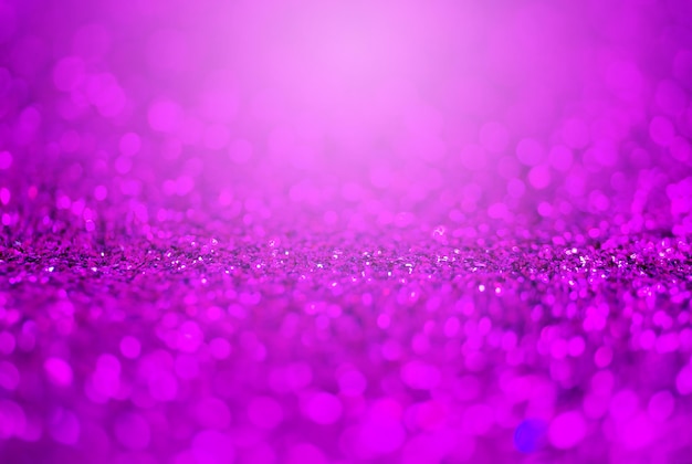 Glitter light abstract purple bokeh light trends color blurred background