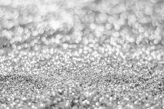 Glitter light abstract silver bokeh blurred background 
