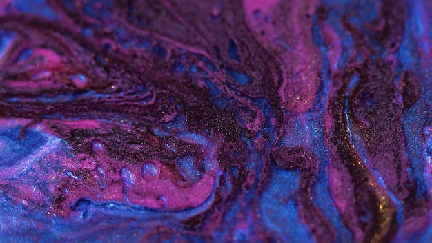 Glitter paint spill oil fluid flow purple blue ink