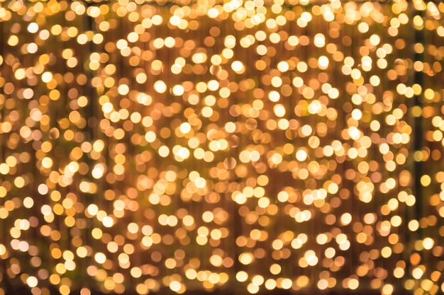 Glittering Glowing and Sparkling defocused Gold Light Illumination outdoor background