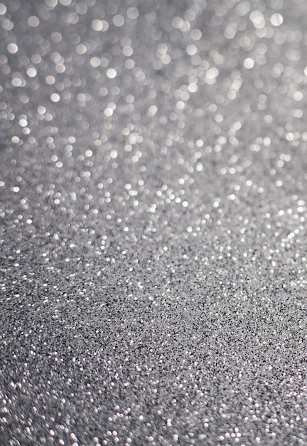 Photo glittering silver or shining particles texture with sparkling light