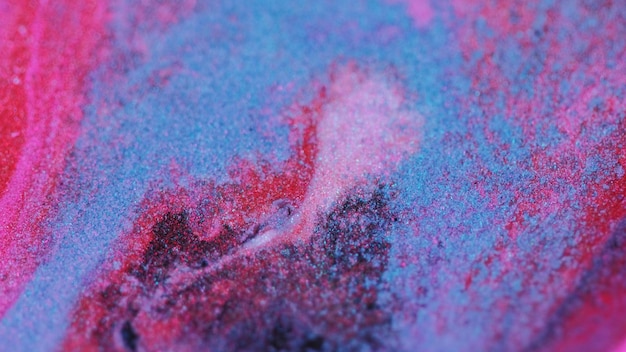 Glitterverf textuur inktstroom roze blauwe korrel