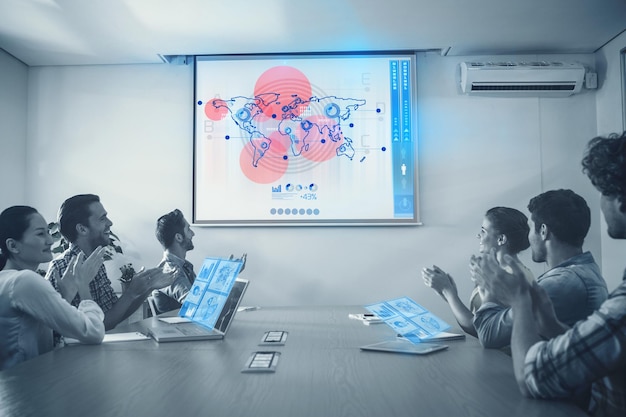 global business interface against attentive business team applausing after a conference